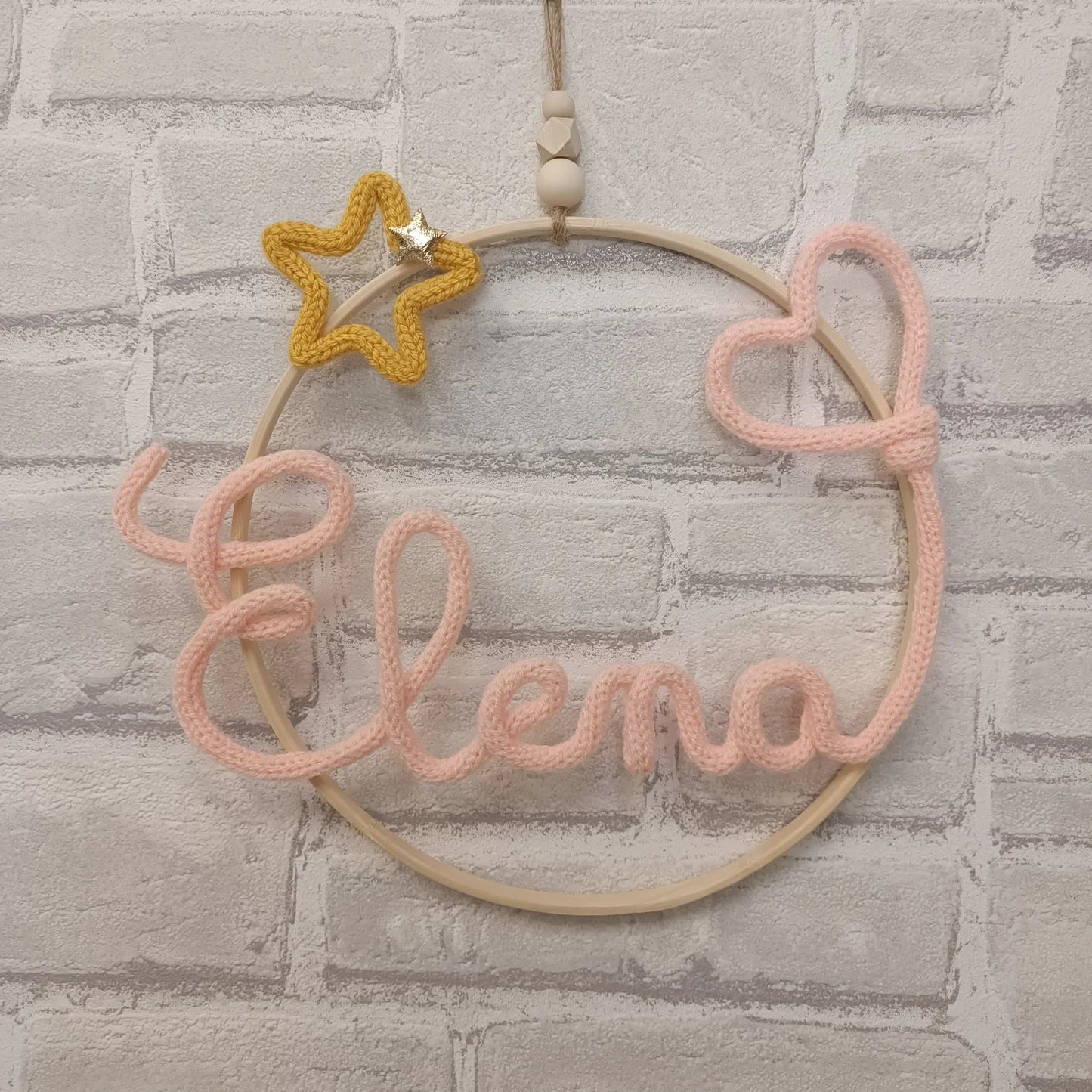 Prénom en tricotin Elena couleur pêche avec étoile